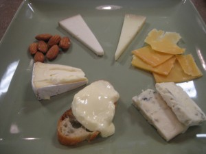 From bottom clockwise: Crescenza, Nettle Meadow Kunik, Tomme Dolce, Abbaye de Belloc, Gouda, Big Woods Blue